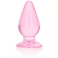 A pink anal plug with a tapered shape and a suction cup base.