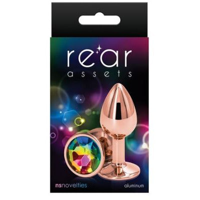 The product image shows a small, chrome-plated anal plug with a pointed tip and a circular base, packaged in a black box with purple and pink accents. The box features the brand name 'Rear Assets' prominently displayed.