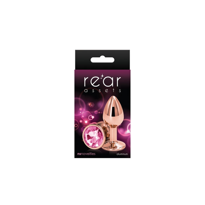 The product image shows a small, chrome-plated anal plug with a pointed tip and a circular base, packaged in a black box with purple and pink accents. The box features the brand name 'Rear Assets' prominently displayed.