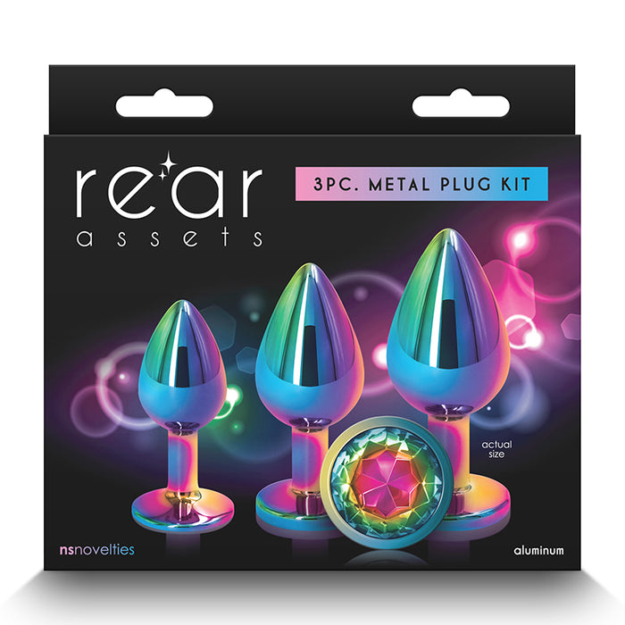 The image features the "Rear Assets Aluminum Metal Anal Plug Kit Circle 3pk by NS Novelties," a set of three anal plugs packaged for retail sale. The plugs are crafted from lightweight aluminum with a chrome-plated finish, adding a touch of elegance and sophistication.