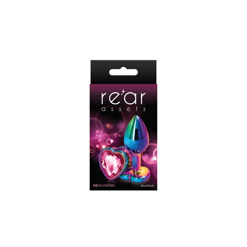 The product image shows a package with the branding 'Rear Assets' featuring a heart-shaped, multicolored anal plug. The packaging is predominantly black with purple and pink accents, highlighting the product's aesthetic appeal.