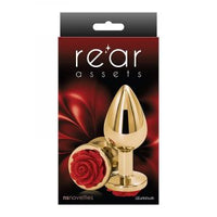 The product image shows a shiny, gold-colored anal plug with a rose-shaped base, presented in a package with a red and black design.