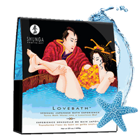 Packaging of Love Bath Crystals Ocean Temptation by Shunga, featuring an illustration of a red and yellow bath scene with a couple.