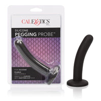 The image shows a black silicone pegging anal probe with a curved design and a round tip. The product is displayed both in and out of its packaging, which features the Cal Exotics branding.