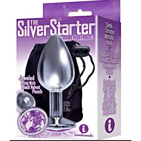 The product image shows the packaging of "The Silver Starter" anal plug, which is silver-colored, teardrop-shaped, and features a sparkling jewel at the top. The package is purple, and the plug is displayed in front of a black storage pouch.