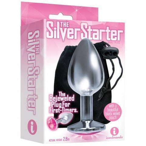 The product image shows the packaging of "The Silver Starter" anal plug, which is silver-colored, teardrop-shaped, and features a sparkling jewel at the top. The package is pink, and the plug is displayed in front of a black storage pouch.