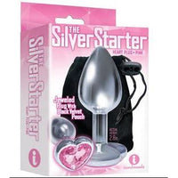 The product image shows the packaging of "The Silver Starter Heart Plus" anal plug, which is pink and has a jeweled design. The package is predominantly pink and showcases the plug alongside its features.