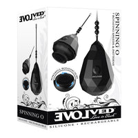 The product image shows the packaging of the Spinning O Rechargeable, featuring a black diamond-textured egg and a spinning silicone brush with nubs. The box highlights features like the powerful motor, LED illumination, and magnetic rechargeability.