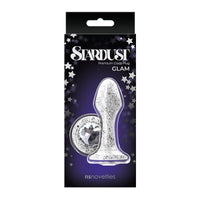 The product image shows the Stardust anal plug in its packaging. The plug is silver with glitter and colored crystal accents, and the packaging is black with star decorations.
