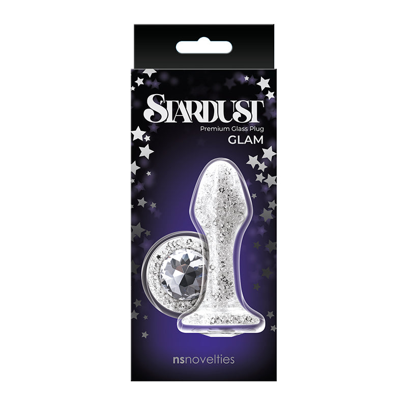 The product image shows the Stardust anal plug in its packaging. The plug is silver with glitter and colored crystal accents, and the packaging is black with star decorations.